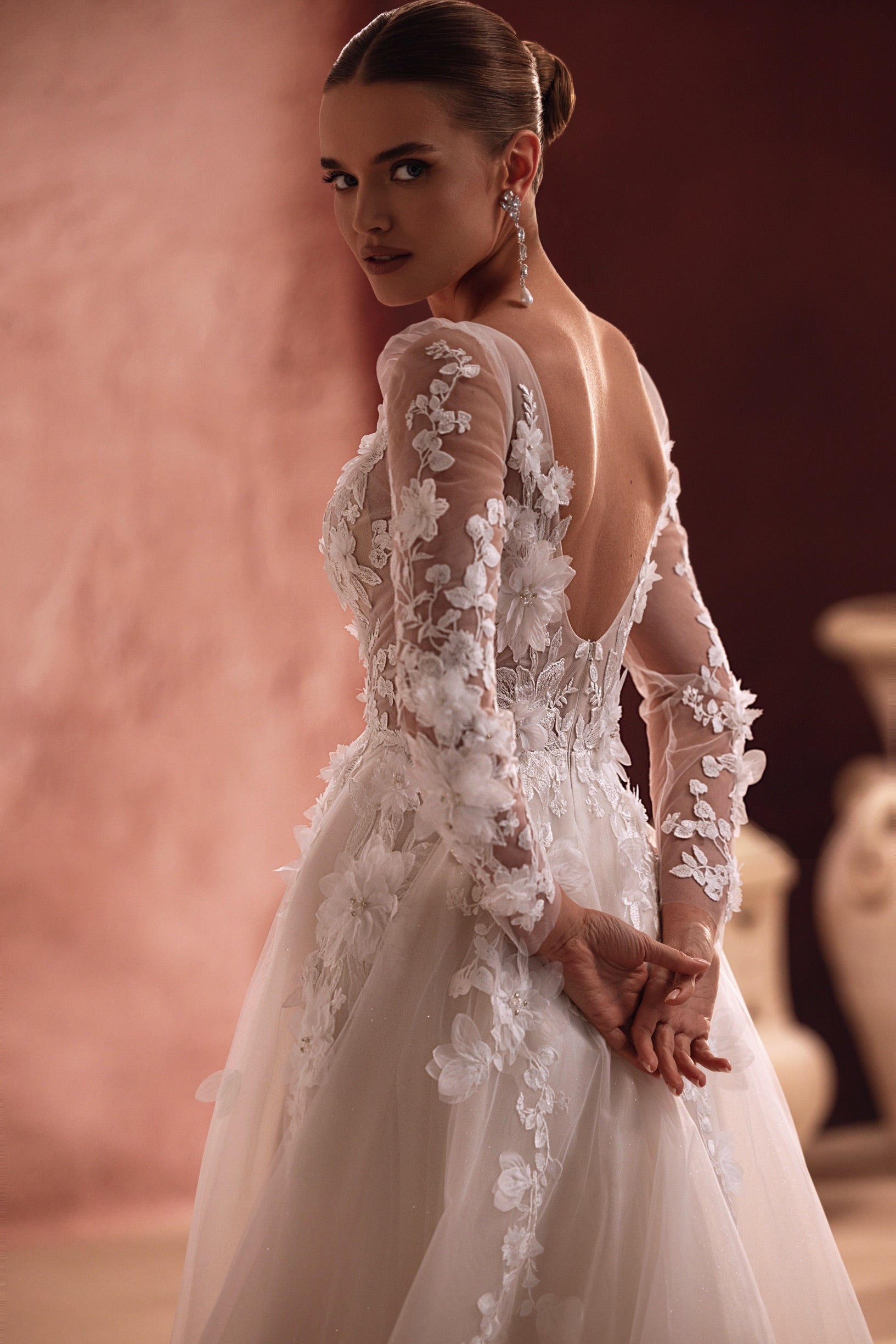 Close-up on the Semiramida corset shows intricately made three-dimensional flower appliqués, giving the gown a rich, textured look.