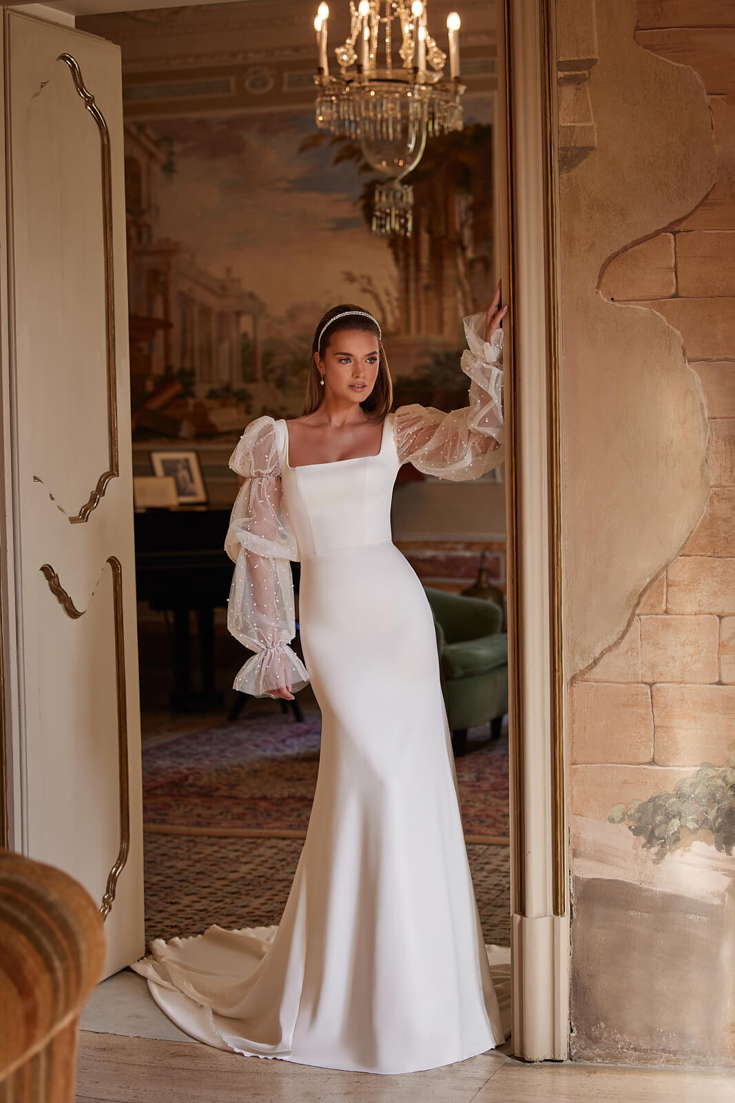 Wedding dress Clara – mermaid wedding dress with long sleeves by DAMA Couture.