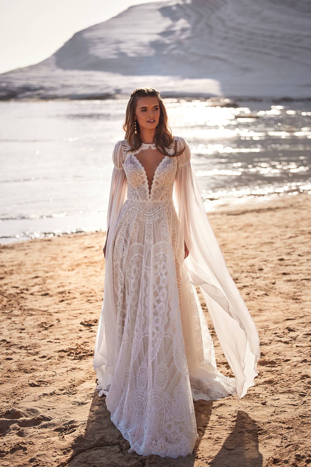 Wedding dress Hope – A-line wedding dress with long sleeves by DAMA Couture.