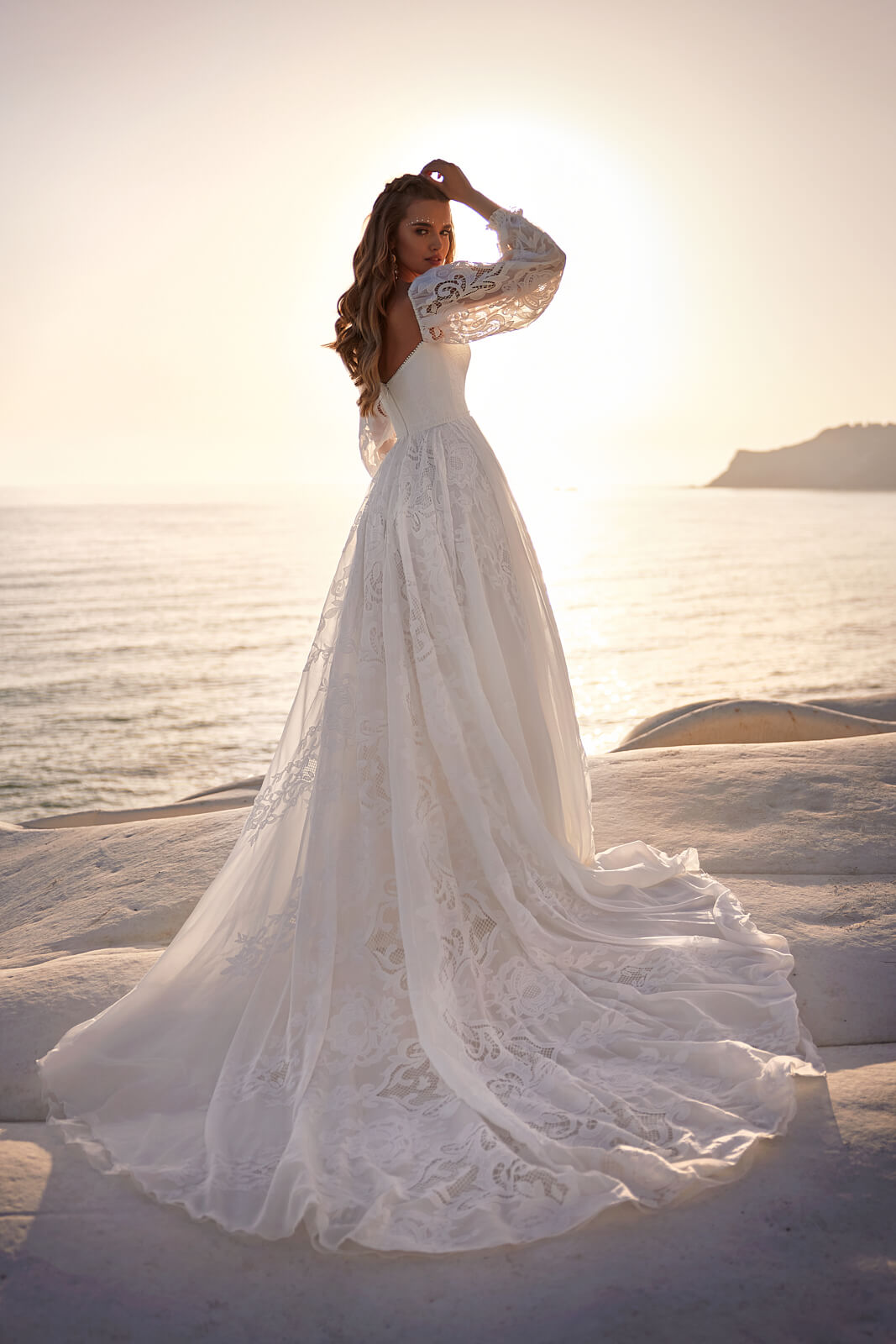 Wedding dress Rania – A-line wedding dress with long sleeves by DAMA Couture.