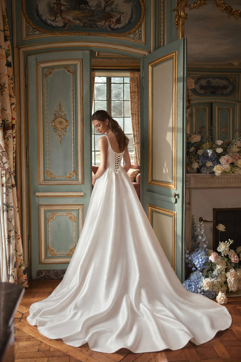 Aretuza wedding dress – A-line bridal gown with a clean square neckline, slender straps and full satin skirt.