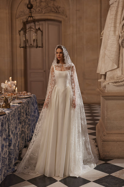 Aretuza wedding dress – bridal gown with a clean square neckline, slender straps and full satin skirt, DAMA Couture.