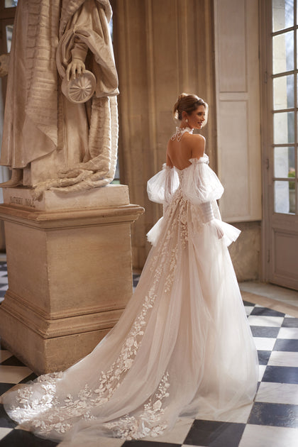 Estella wedding dress from the Something Blue 2027 collection – a dimensional floral corset and voluminous off-the-shoulder sleeves.