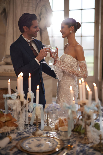 Irulian wedding dress from the Something Blue 2027 collection – a strapless shimmering bodice and fitted lace silhouette.