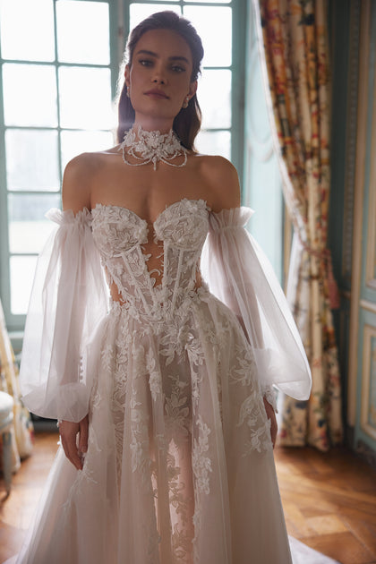 Melusine wedding dress – A-line bridal gown with a strapless botanical lace bodice and detachable tulle sleeves.