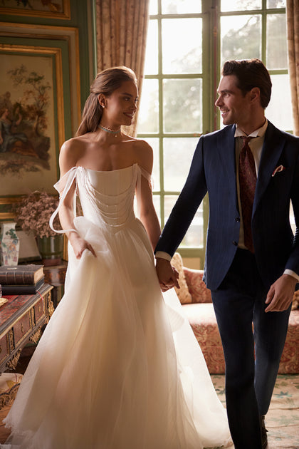 Nerina wedding dress – A-line bridal gown with jewellery-like detailing and off-the-shoulder tulle straps.