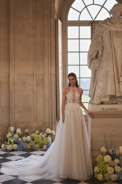 Nilla wedding dress from the Something Blue 2027 collection – a sheer high neckline and floral lace tulle skirt.