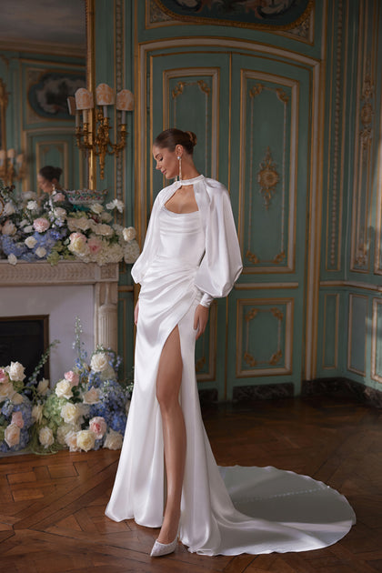 Sodden wedding dress – a softly draped strapless neckline and high slit in fluid satin, DAMA Couture Something Blue 2027.