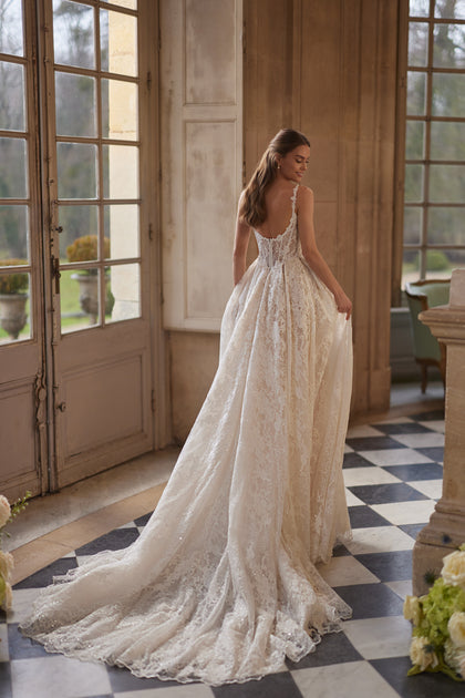 Thetis wedding dress – sheer corsetry, lace straps and an opulent lace skirt.