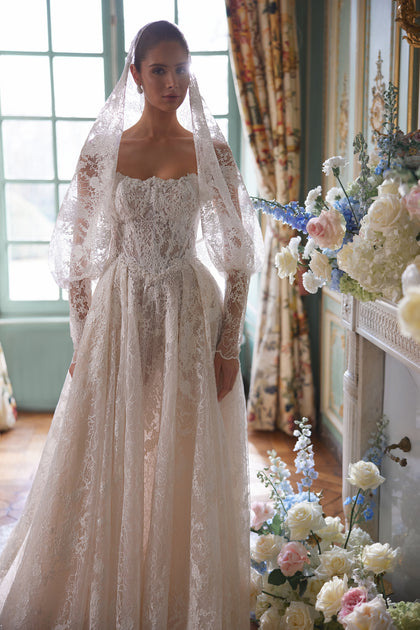 Thetis wedding dress – A-line silhouette with sheer corsetry, lace straps and an opulent lace skirt.