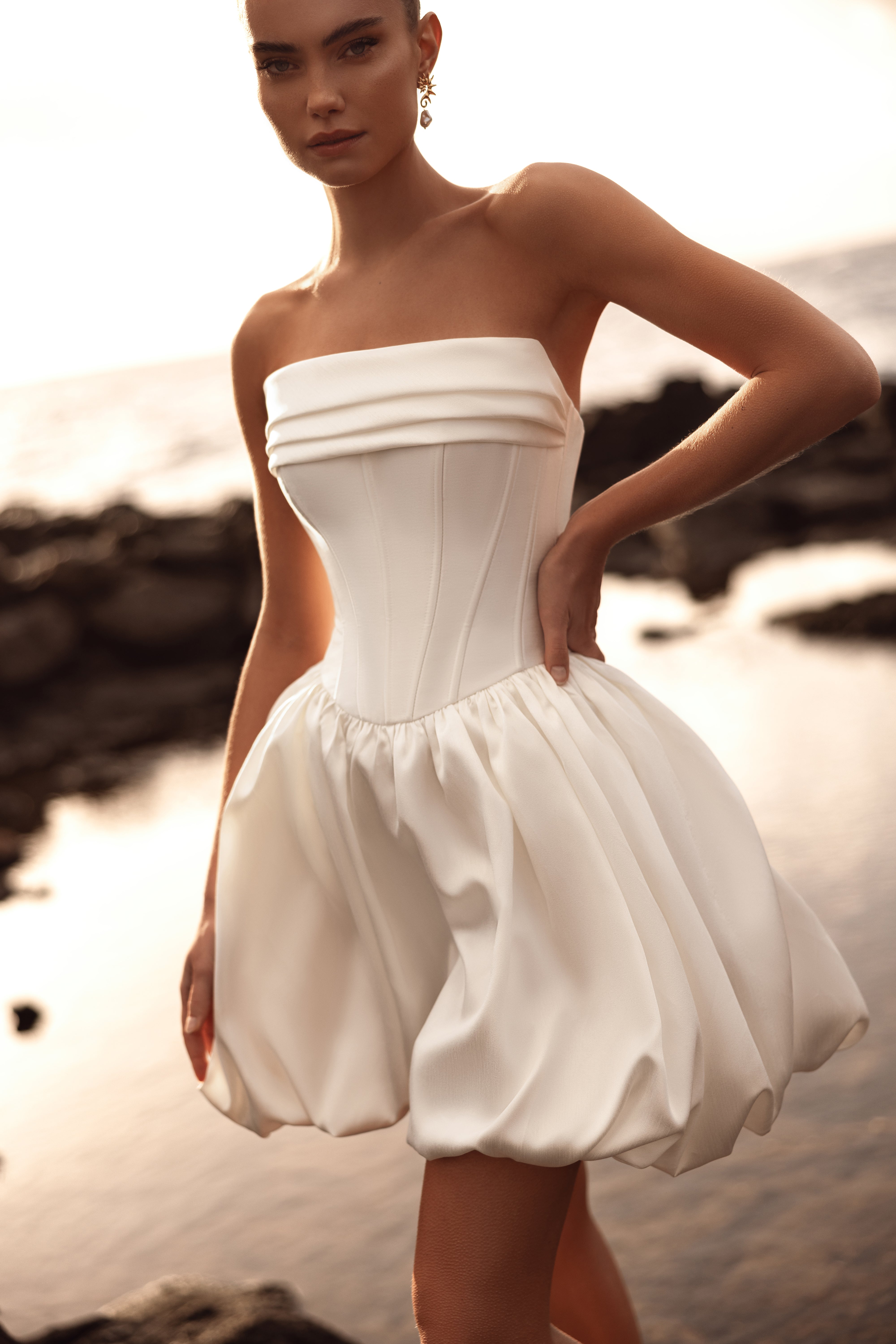 Martini short wedding dress with a structured bustier corset and bubble skirt is a modern, chic choice for the stylish bride.
