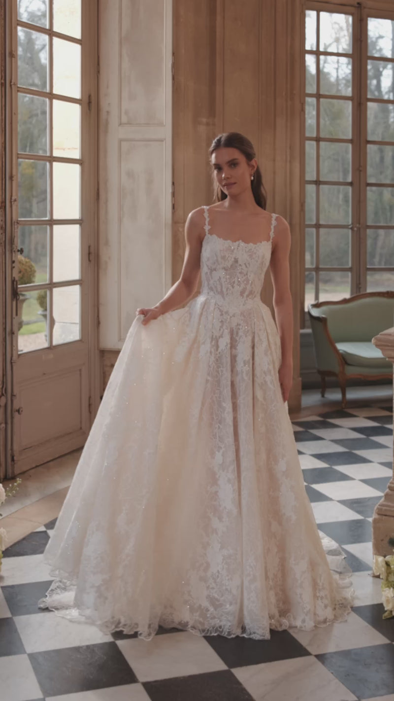 Video of the Thetis wedding dress – sheer corsetry, lace straps and an opulent lace skirt.