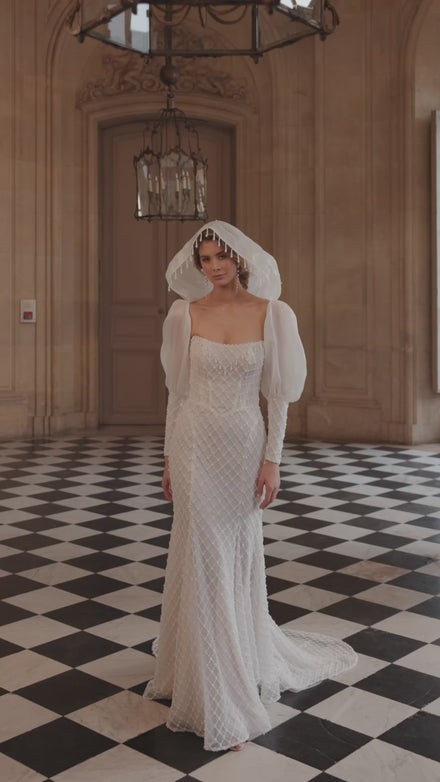 Video of the Chanin wedding dress – a clean strapless neckline and beaded fitted silhouette.