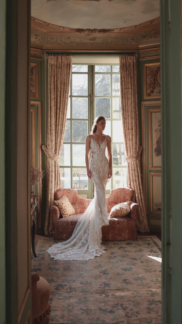 Video of the Ondine wedding dress in motion – mermaid silhouette with a plunging V-neckline and deep illusion scoop back.