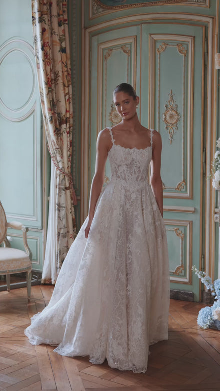Video of the Thetis wedding dress in motion – A-line silhouette with sheer corsetry, lace straps and an opulent lace skirt.