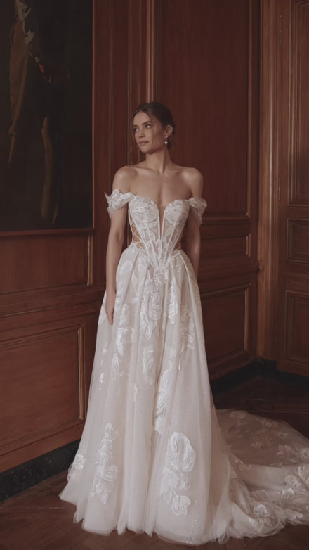Video of the Vespera wedding dress in motion – A-line silhouette with an off-the-shoulder corset with a plunging neckline and sheer boning.