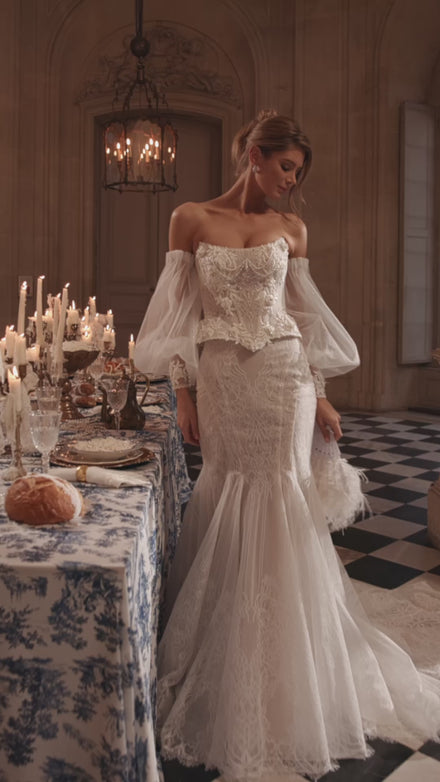 Video of the Tara corset + Thea mermaid skirt in motion – mermaid silhouette with a structured Tara corset with off-the-shoulder sleeves and the Thea mermaid skirt.