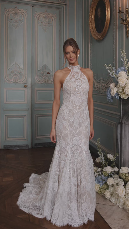 Video of the Maraya wedding dress in motion – mermaid silhouette with a halter neckline and figure-tracing lace.