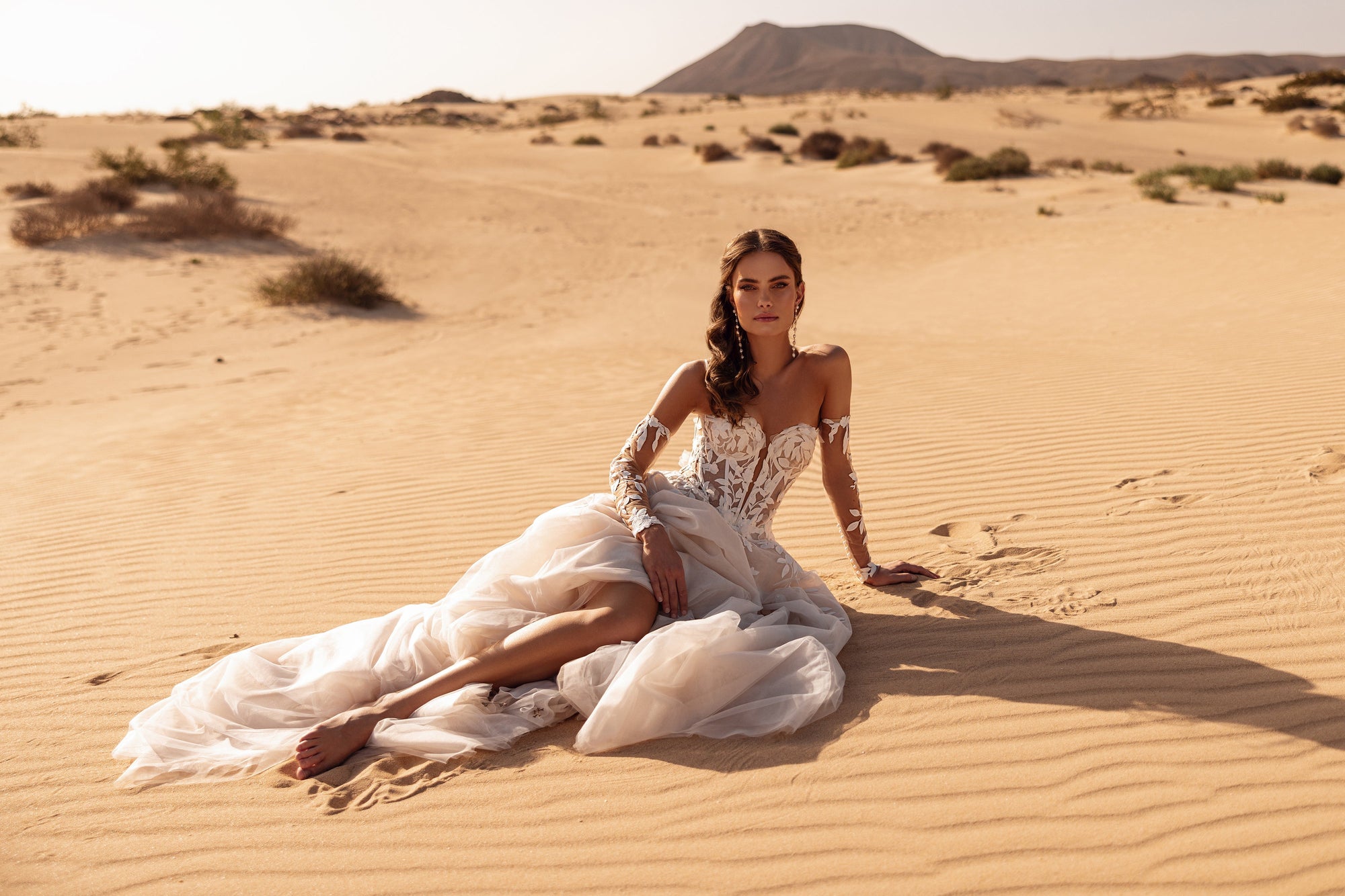 The Tamara short wedding dress with tulle overskirt reveals a bold and modern bridal style.